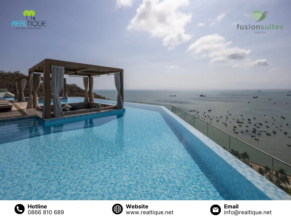 Infinity pool on the rooftop with a panoramic view of the coastal city